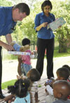 Rob MacKenzie and Farhaana Mohidien handing over gifts